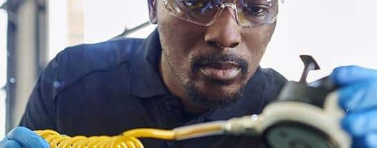 Speedy glass expertise A speedy glass expert repairs a broken windshield