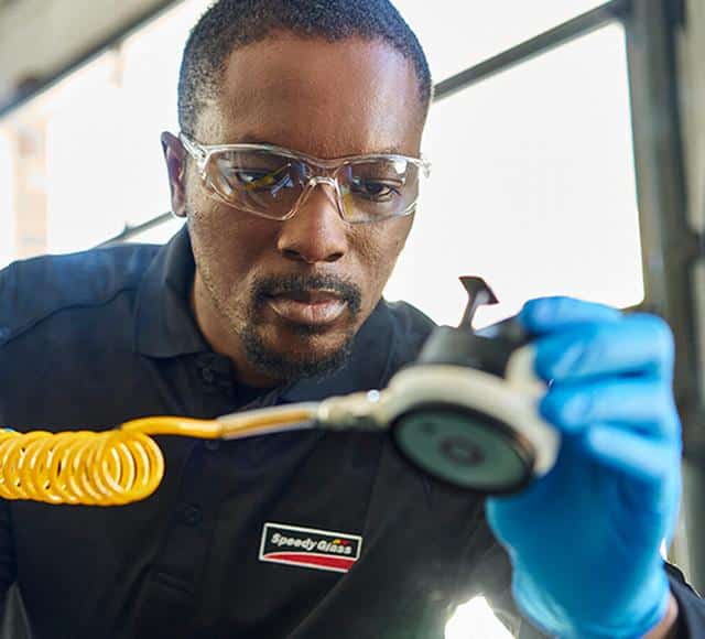 windshield repair A Speedy glass technician repairs a windshield